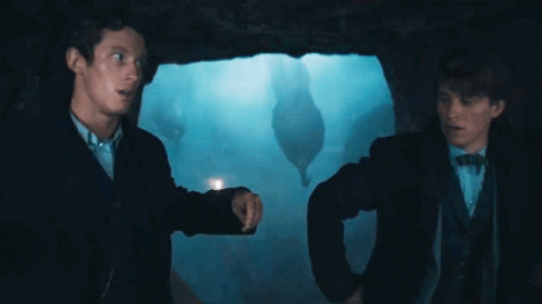 Newt Scamander Dodging Octopus Tentacles GIF