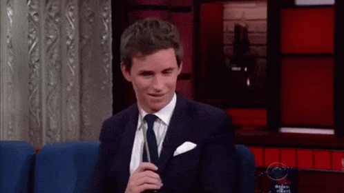Newt Scamander Scratching Head With Wand GIF