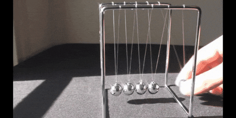 Newton Pendulum In The Sunlight GIF
