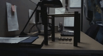 Newton Pendulum On Office Desk GIF