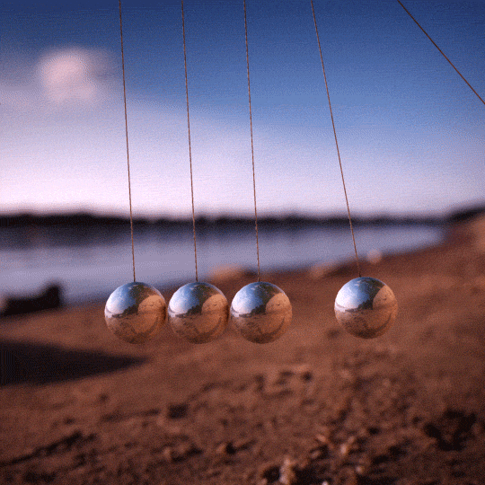 Newton Pendulum On The Beach GIF