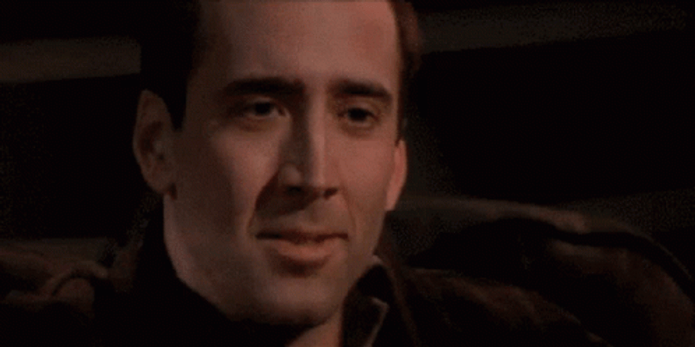 Nic Cage Mixed Emotions Laughing Out Loud GIF