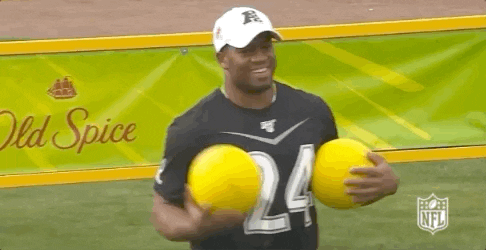 Nick Chubb Holding Two Yellow Balls GIF
