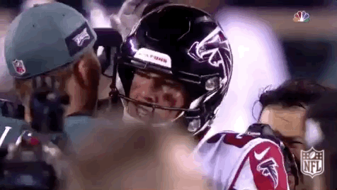 Nick Foles Interacting With Atlanta Falcons Player GIF