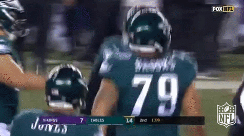 Nick Foles Running Alongside Philadelphia Eagles Teammates GIF