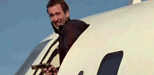 Nicolas Cage Face Off Scene In Airplane GIF