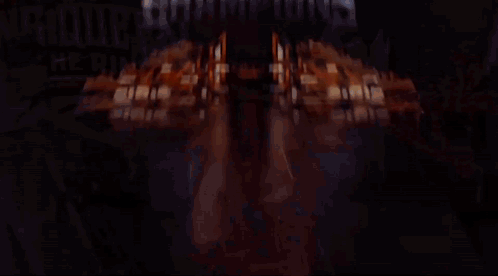 Night Of The Champions Is Written In White Letters On A Dark Background GIF