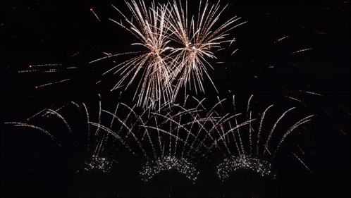 Night Sky Fireworks With Sun Shining