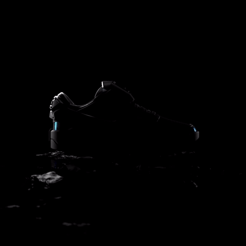 Nike Black And White Shoe With Blue Swoosh GIF
