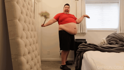 Nikocado Avocado Holding A Feather Duster GIF