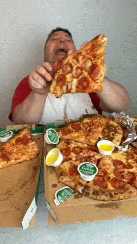 Nikocado Avocado Holds And Rubs Pizza On Face GIF