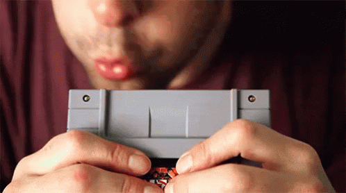 Nintendo Blowing Video Game Cartridge GIF