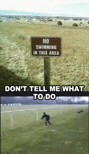 No Swimming Sign Next to Soccer Field