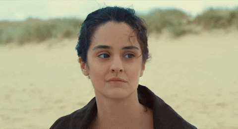 Noémie Merlant Chuckle GIF
