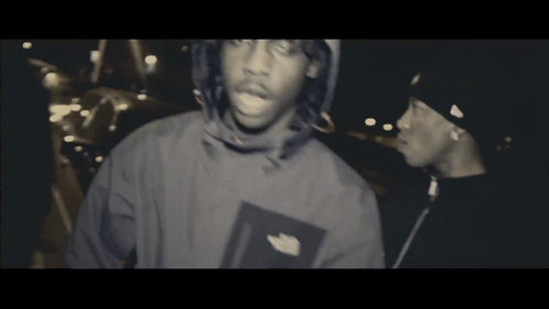 North Face Jacket Man Beside Black Hat Man GIF