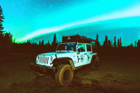 Northern Lights Moment Above A Car GIF