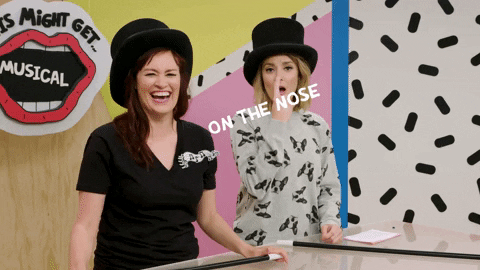Nose Goes Two Ladies Wearing Magic Hat GIF