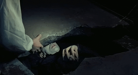 Nosferatu Lying Down Removing The Rock GIF