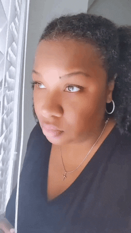 Nosy Woman Looking Out The Window GIF