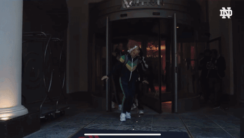 Notre Dame Guy Runs Out GIF
