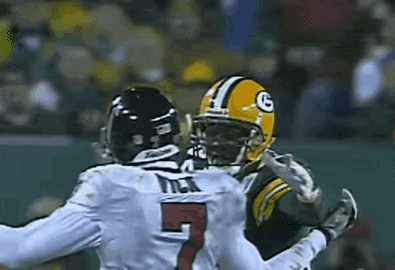 Number 5 Jersey Player Tackled by Packers