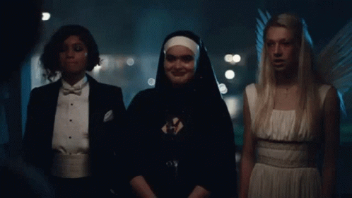 Nun And Two Angels Standing Together GIF