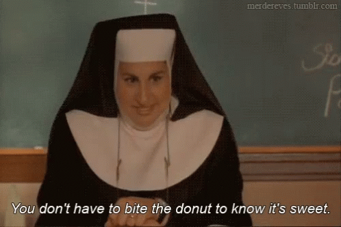 Nun by Chalkboard Says Don't Bite Donut