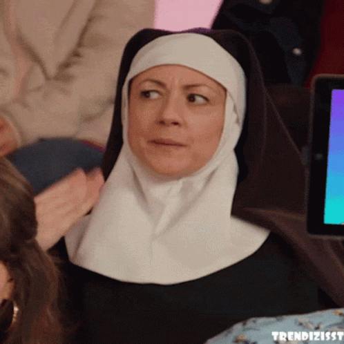 Nun Sitting at Tablet with Trendizisst