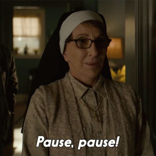 Nun with Glasses and White Headband Says Pause Pause