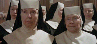 Nuns Standing In A Row Looking At Something GIF