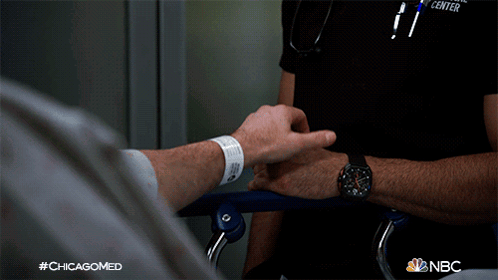 Nurse Holding Patient Hand NBC Chicagomed Ad GIF