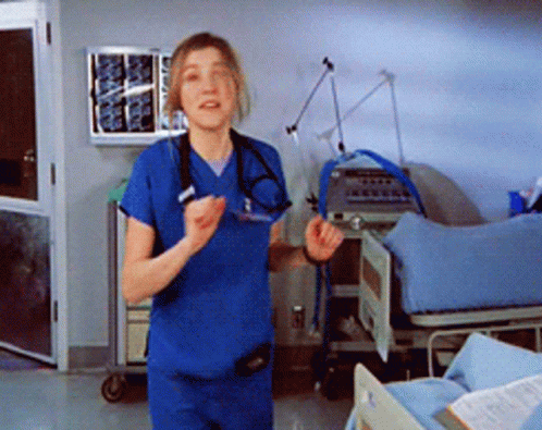 Nurse in Blue Scrubs in Hospital