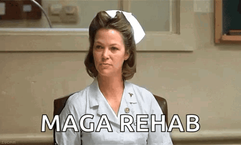 Nurse Sitting In Chair With MAGA Rehab Screen GIF