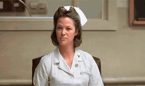 Nurse Sitting In Hospital Chair GIF