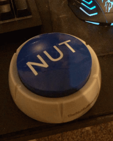 Trying To Press The Nut Button Toy GIF
