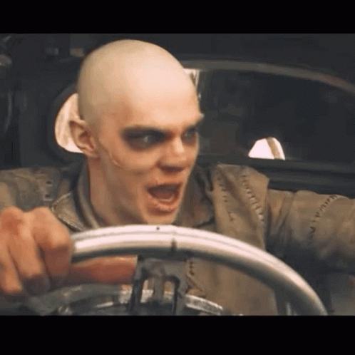 Nux Of Mad Max Fury Road Cheerfully Drive Off Max Rockatansky GIF