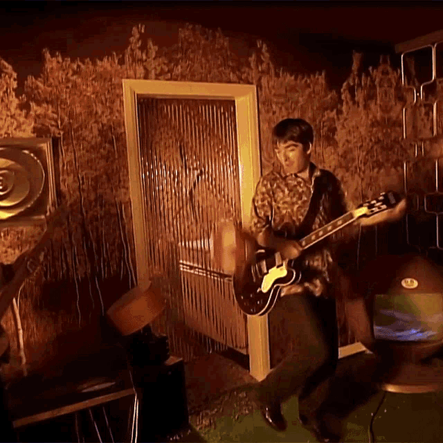 Oasis Band Members Playing GIF