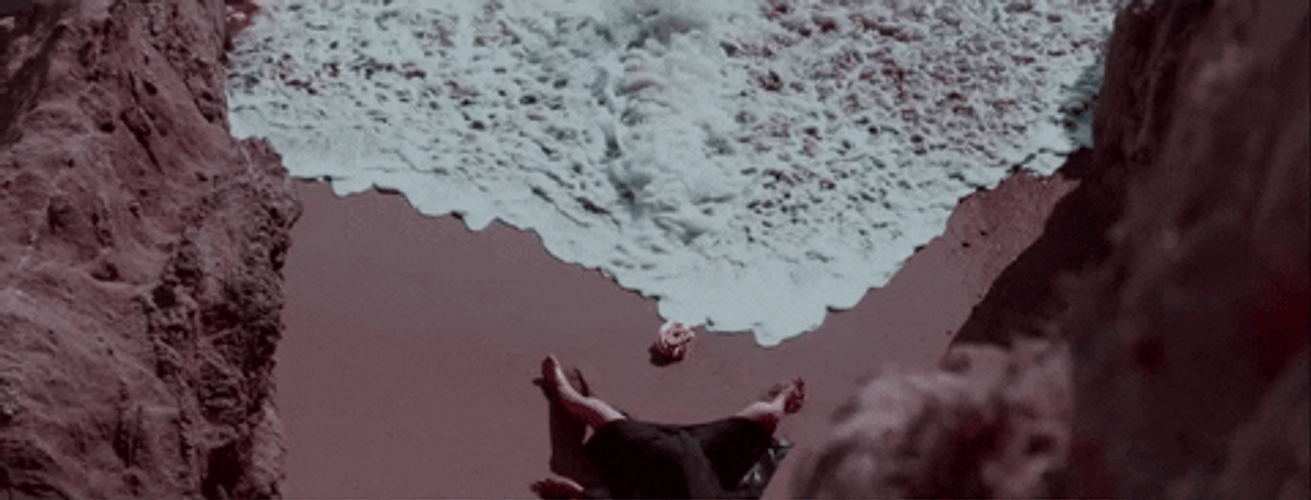 Ocean Waves While Sleeping On The Sand GIF