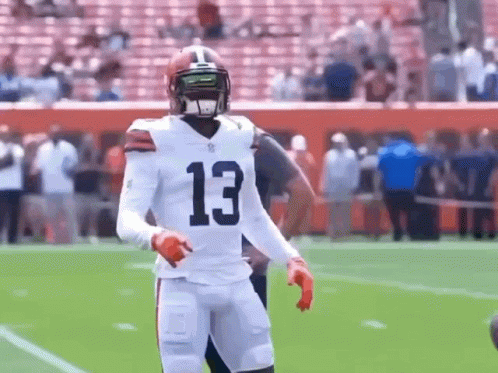 Odell Beckham Jr Points Upward Then Strangle Pose GIF
