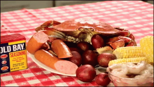Old Bay Seasoning Box Next to Plate of Food