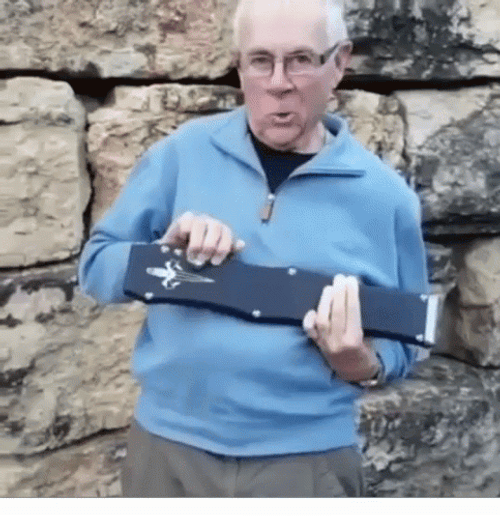 Old Man Holding Big Butterfly Knife GIF