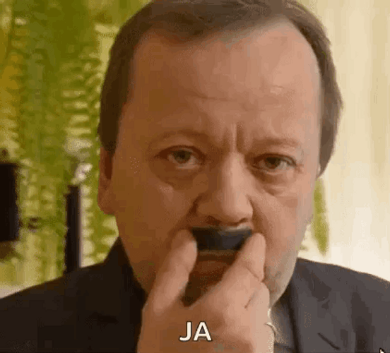Old Man Playfully Rubbing Mustache GIF