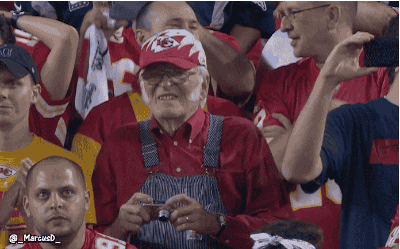Old Man Watching Game Using Binoculars GIF