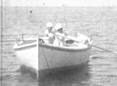 Old Video Film 2 Boys Riding Skiff GIF