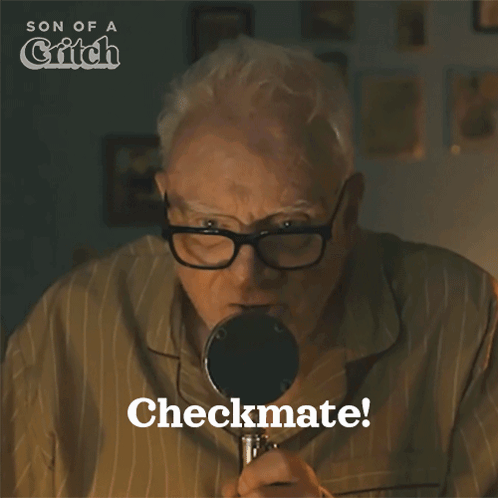 Older Man Looking Through Magnifying Glass