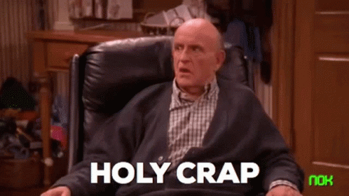 Older Man Sitting in Chair With Holy Crap