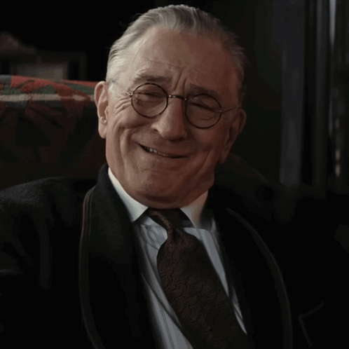 Older Man Smiling In Glasses And Tie GIF