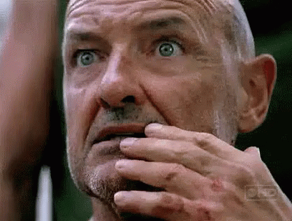 Older Man With Beard Covering Mouth GIF