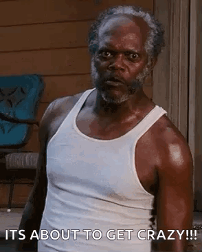 Older Man With Beard in White Tank Top Making Funny Face