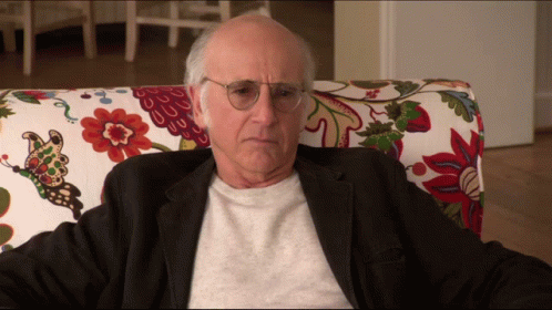 Older Man With Glasses in Floral Chair